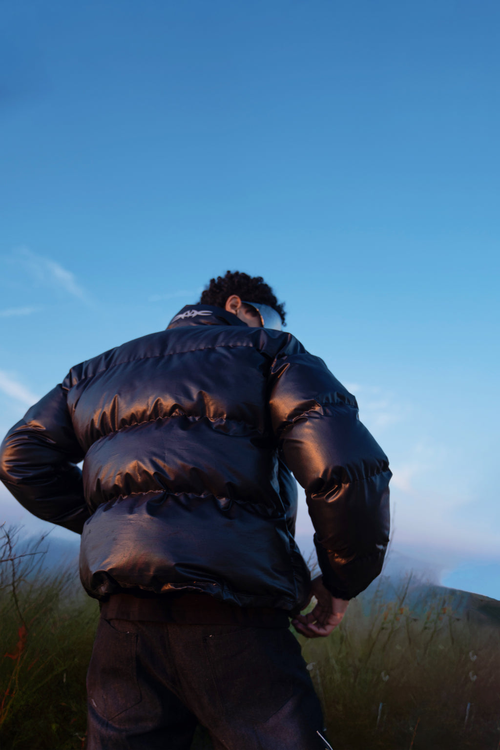 Leather effect puffer jacket in black