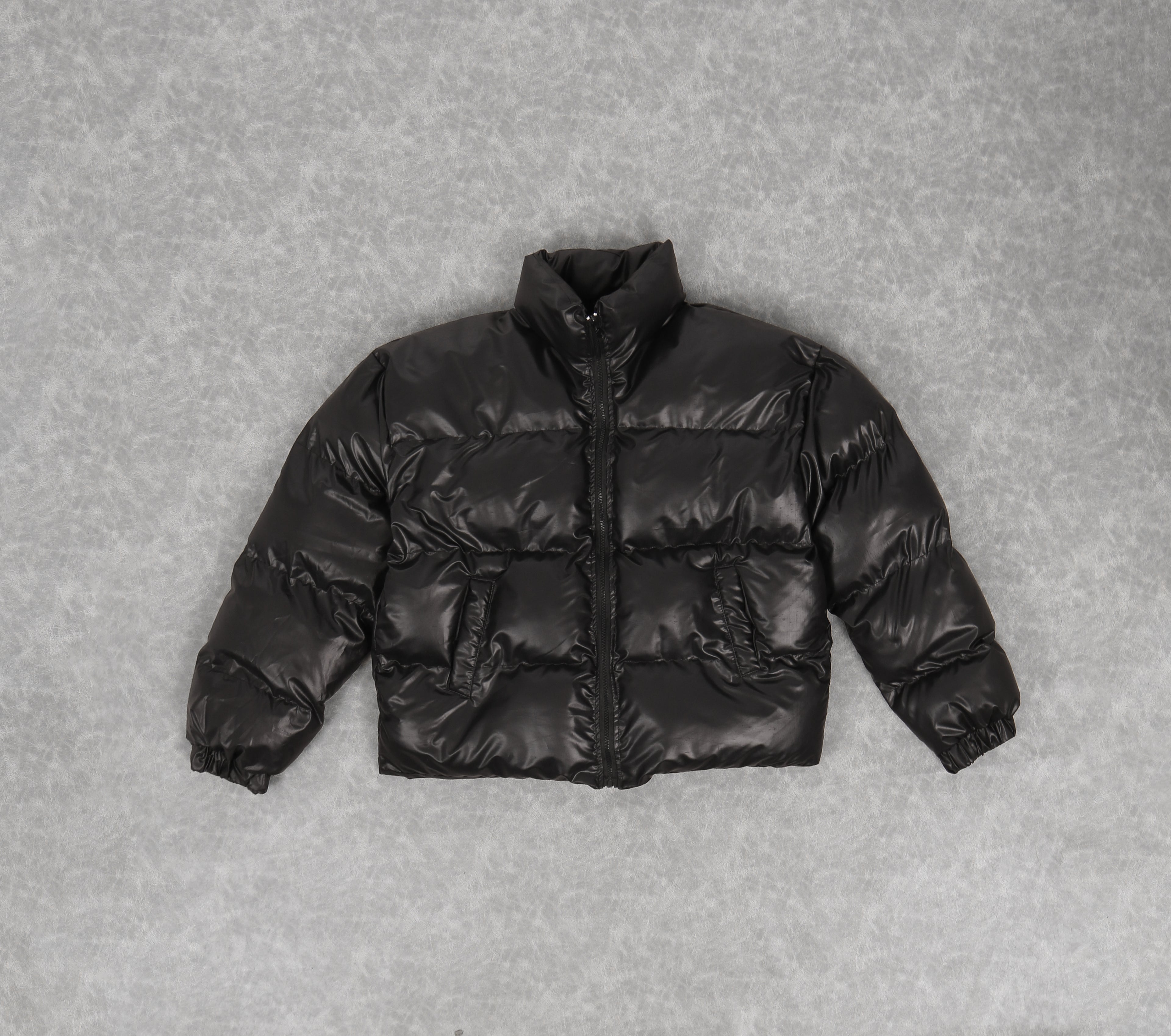 Leather effect puffer jacket in black