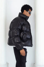 Leather effect puffer jacket in black
