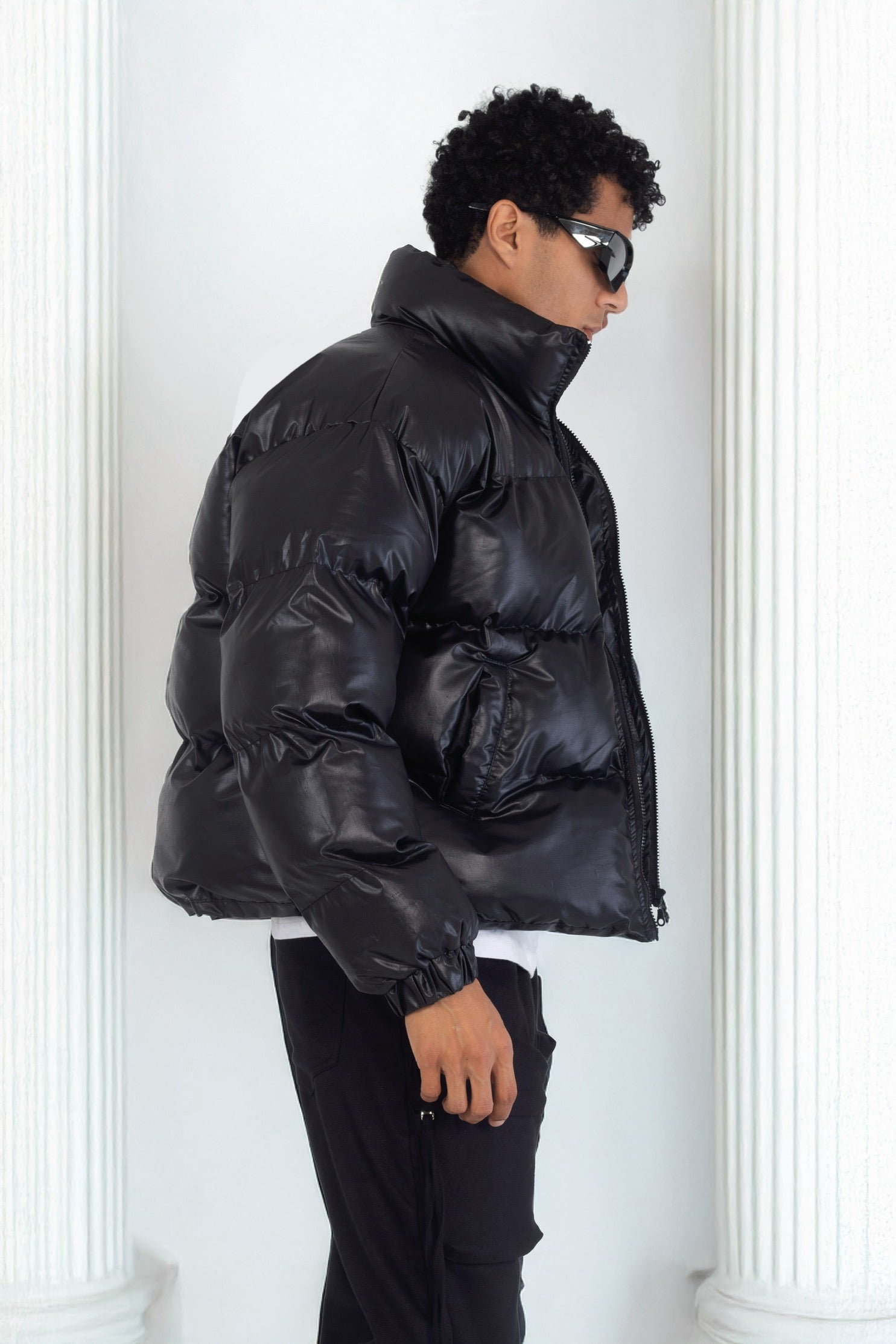 Leather effect puffer jacket in black